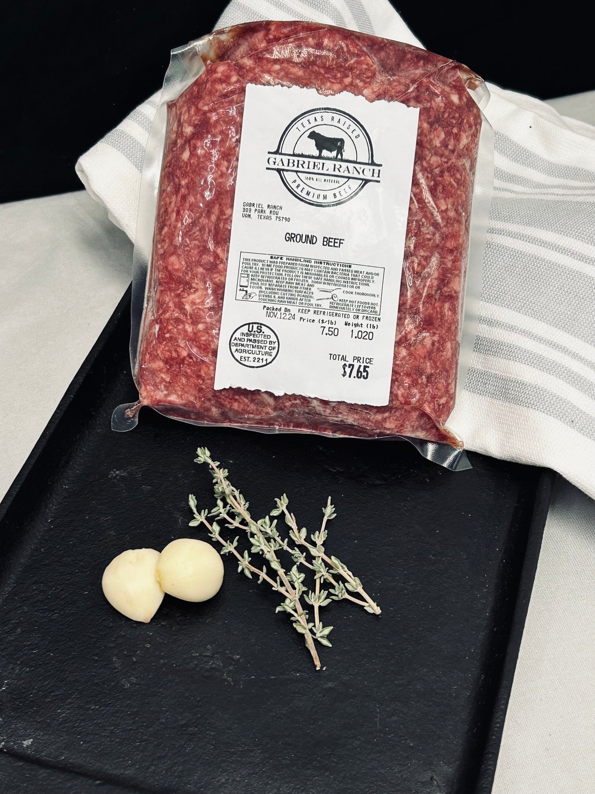 Close-up of marbled beef cuts with visible grain finish and hand-trimmed edges, showcasing quality and texture detail