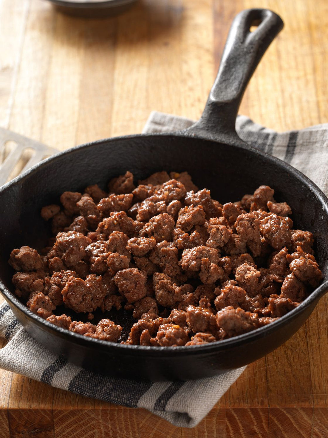 Raw quarter cuts of beef and chicken on wooden boards, Gabriel Ranch brand.